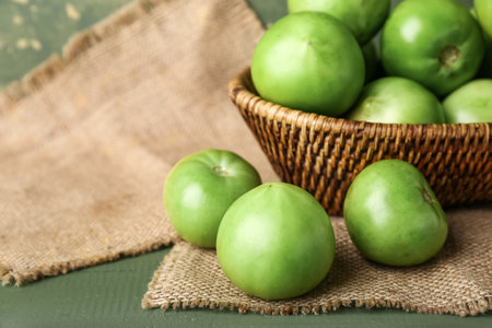 fresh green tomatoes on tableの写真素材