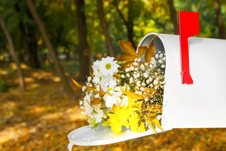 Mailbox with beautiful bouquet in autumn parkの写真素材
