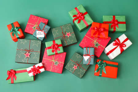 Different Christmas presents on color background