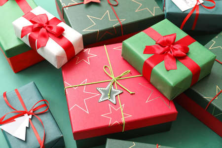Different Christmas presents on color background