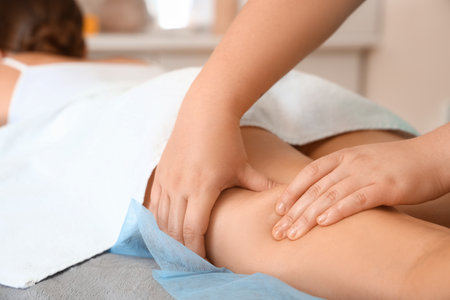 Young woman having anti-cellulite massage in beauty salonの写真素材