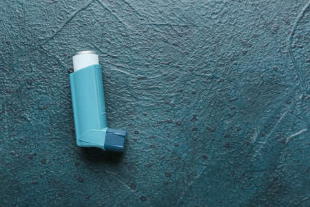 Asthma inhaler on dark backgroundの写真素材