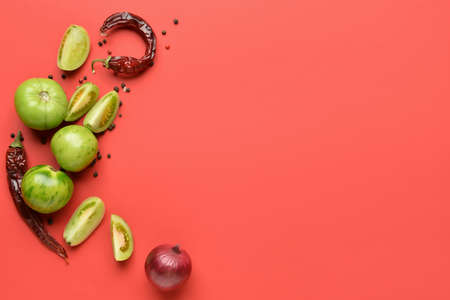 Ingredients for preparing canned tomatoes on color backgroundの写真素材