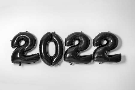 Figure 2022 made of black balloons on light background
