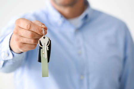 Man holding keys on chain, closeupの写真素材