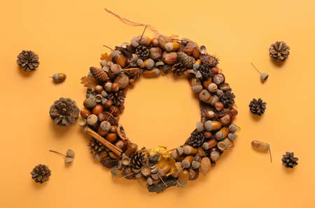 Beautiful acorn wreath on beige backgroundの写真素材