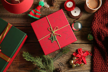 Beautiful composition with gift boxes and Christmas decor on wooden backgroundの写真素材