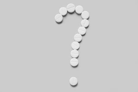 Question mark made of pills on light backgroundの写真素材