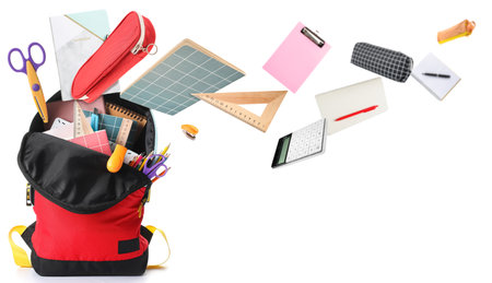 School backpack and stationery on white background