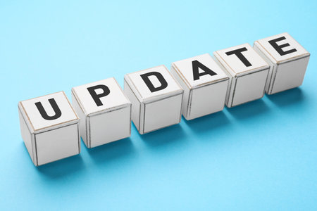 Cubes with word UPDATE on light blue backgroundの写真素材