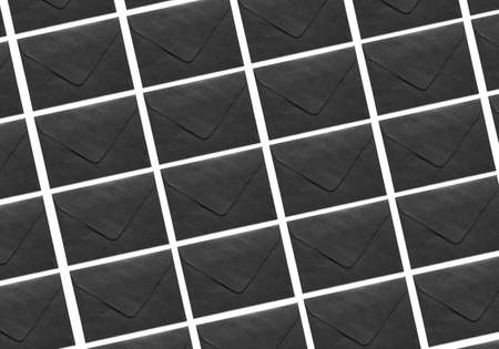 Many black envelopes on white background. Pattern for designの写真素材
