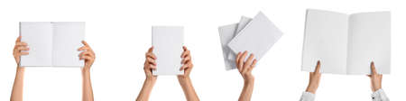 Hands with blank books isolated on whiteの写真素材