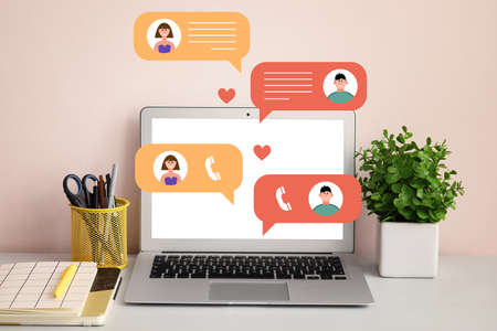 Modern laptop at workplace in office. Concept of online chattingの写真素材