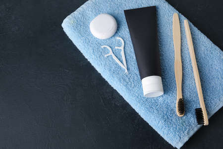 Black toothpaste with activated carbon and set for oral hygiene on tableの写真素材