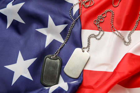Military tags on flag of USAの写真素材
