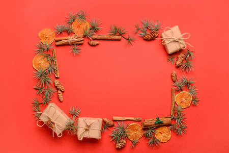 Frame made of Christmas decor on red background