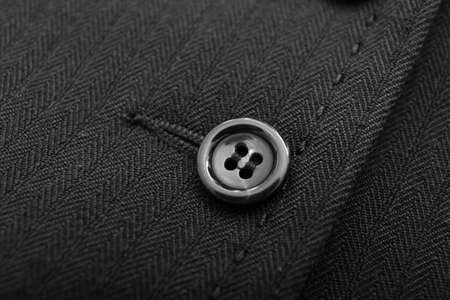 Button on black cloth, closeupの写真素材