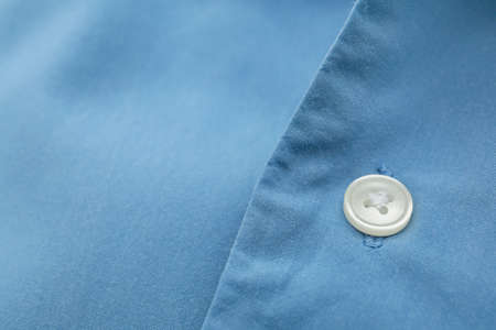 Closeup view of button on linen shirtの写真素材