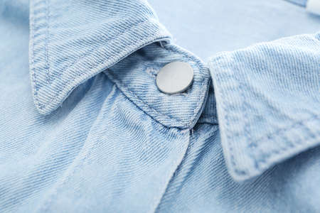Closeup view of button on shirt collar