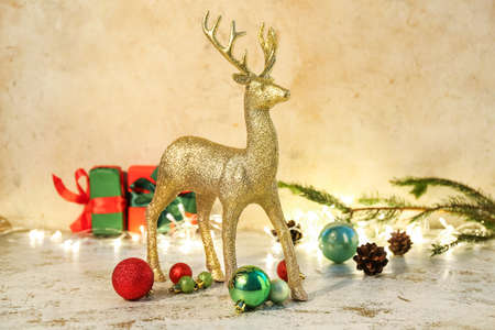 Golden reindeer with Christmas decor on grunge backgroundの写真素材