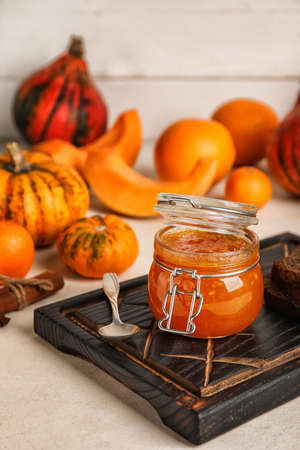 Jar of sweet pumpkin jam on tableの写真素材