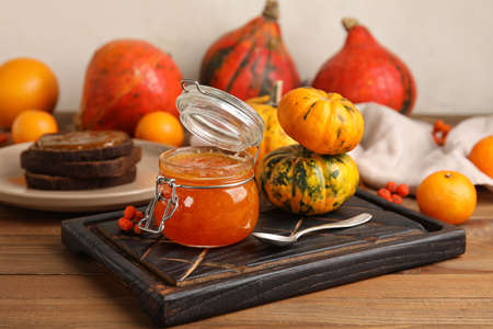 Jar of sweet pumpkin jam on tableの写真素材
