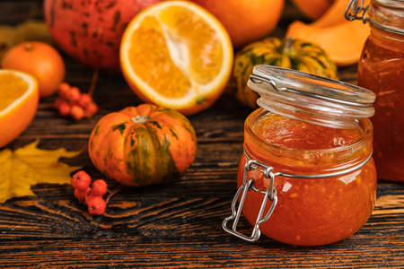 Jar of sweet pumpkin jam on tableの写真素材