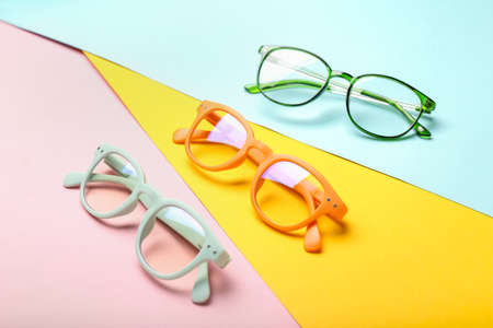 Different eyeglasses on color backgroundの写真素材