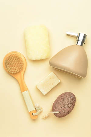 Set of bath supplies for foot massage on color background