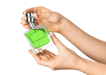 Woman holding bottle of perfume on white background, closeupの写真素材