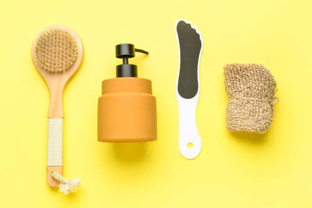 Bath supplies for foot massage on yellow backgroundの写真素材