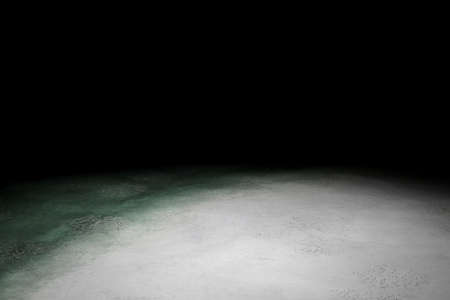 Light surface on black backgroundの写真素材