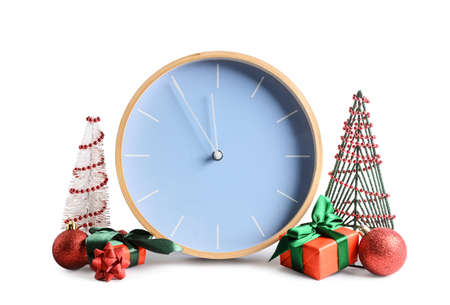 Stylish New Year clock with Christmas decor on white background