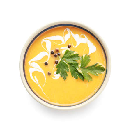 Bowl with delicious homemade pumpkin cream soup on white backgroundの写真素材