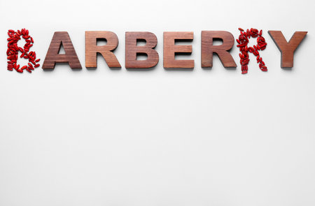 Word BARBERRY with berries on white backgroundの写真素材