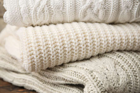 Close up view of stylish knitted sweaters