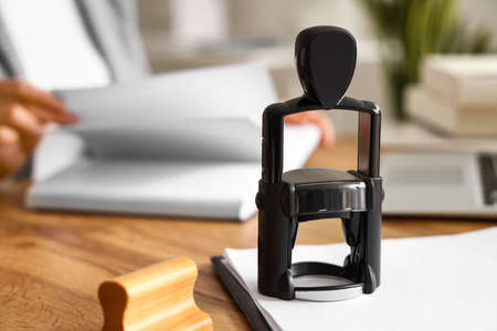 Stamp on table of notary public in officeの写真素材