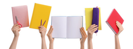 Many hands with school supplies isolated on whiteの写真素材