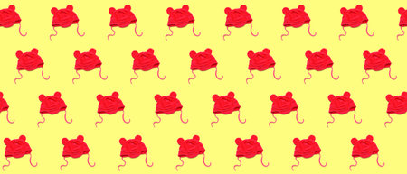 Many baby hats on yellow background. pattern for designの写真素材