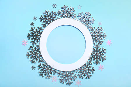 Frame made of beautiful snowflakes on blue backgroundの写真素材