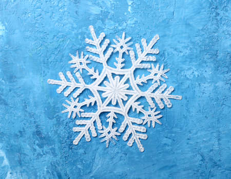 Beautiful snowflake on blue background