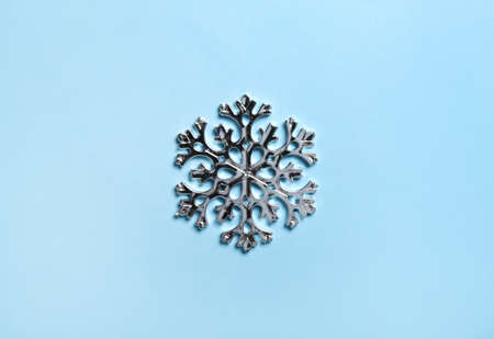 Beautiful snowflake on blue backgroundの写真素材