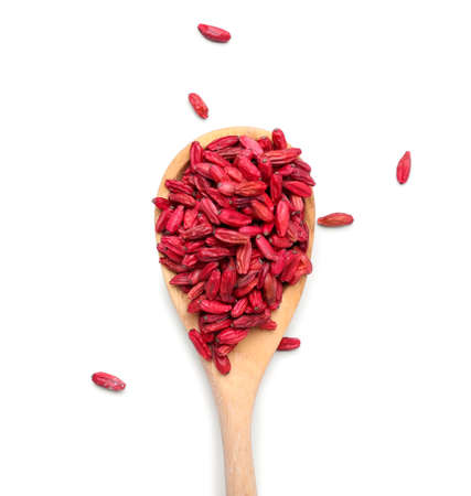 Spoon with dried barberry on white backgroundの写真素材