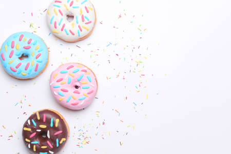 Different delicious donuts on white backgroundの写真素材