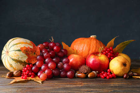 Different healthy food on wooden table. harvest festivalの写真素材