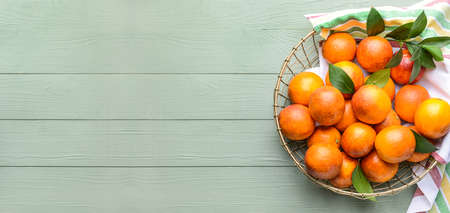 Basket of fresh blood oranges on wooden background with space for text, top viewの写真素材