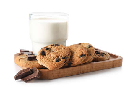Board with tasty homemade cookies and glass of milk on white background