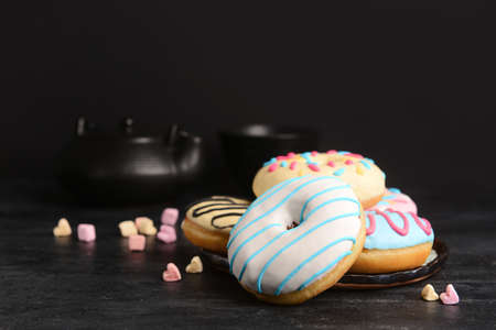 Different sweet donuts on dark backgroundの写真素材