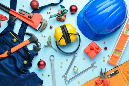 Set of construction tools and Christmas decor on color backgroundの写真素材