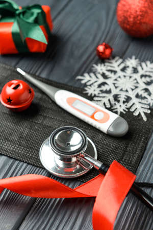 Doctor's tools and Christmas decor on wooden backgroundの写真素材
